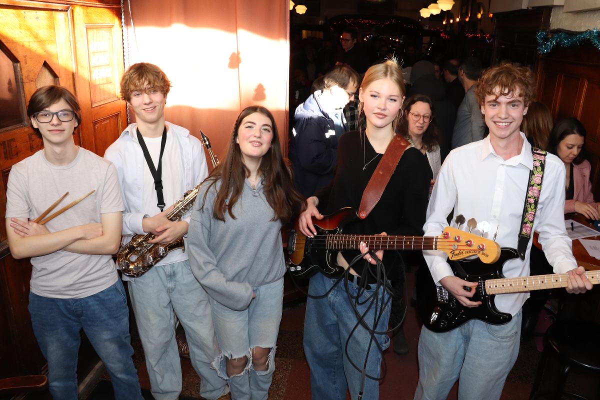Musiprof teen band posing after their performance at Quai des Brumes in Montreal, Quebec.