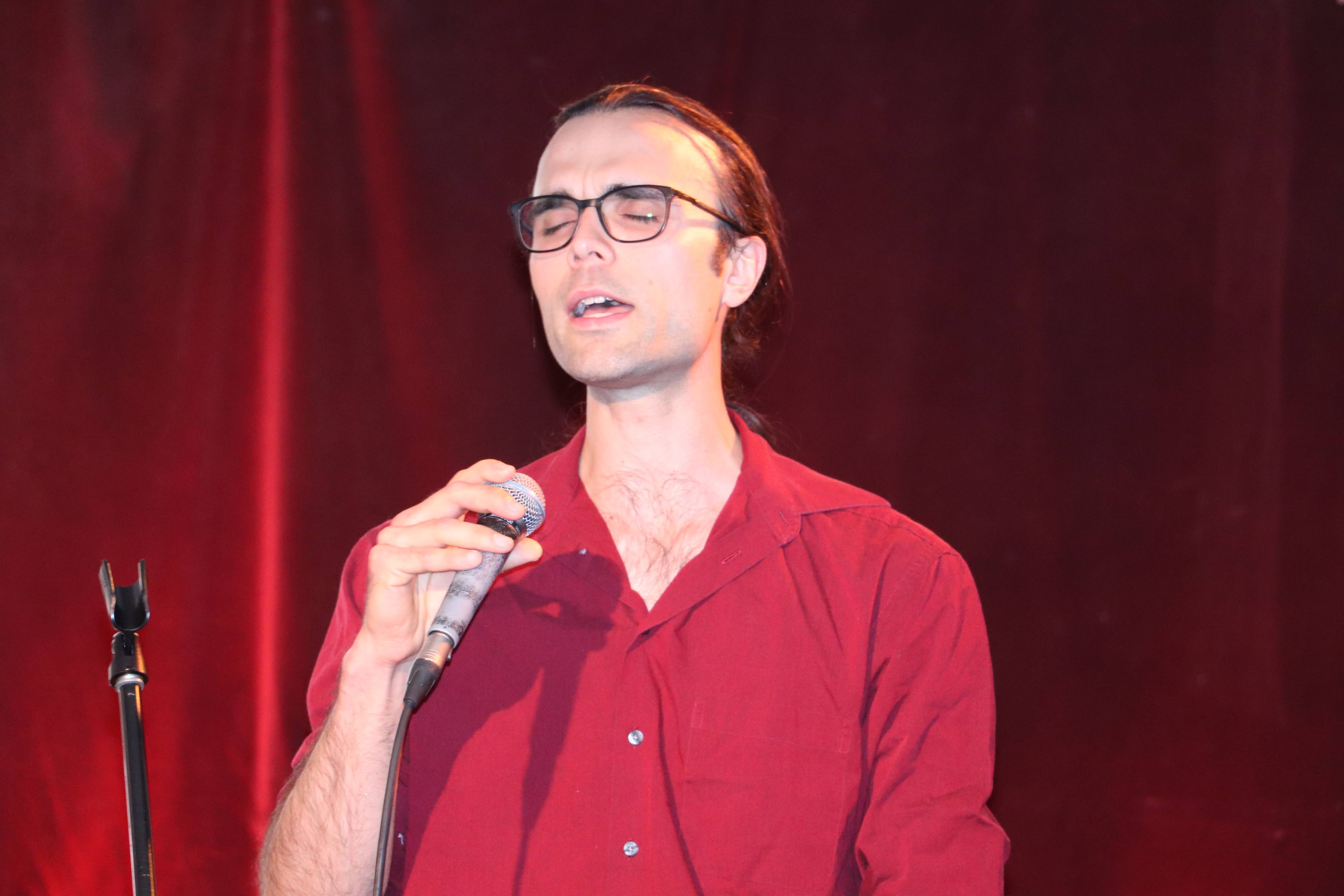 A voice student Jean performing jazz repertoire during a Musiprof community event.